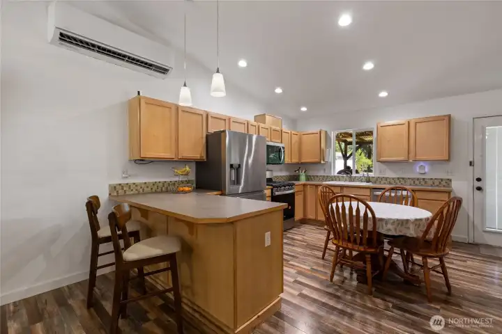 Kitchen with eat in area.