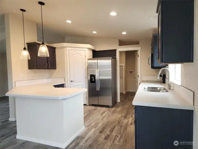 Full view of kitchen with SS appliances.