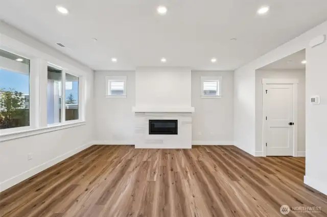 Open concept great room overlooking covered patio in the rear yard.  Photo is representative of a similar floor plan-finishes and inclusions will vary.