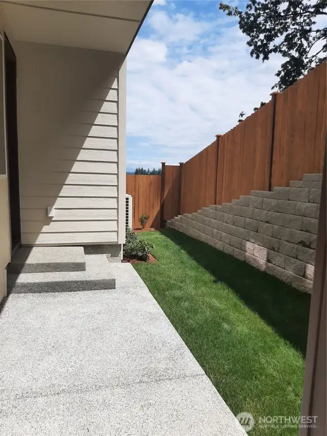 Tranquil rear yard comes fully landscaped and features a partial Cascade Mtn. view.