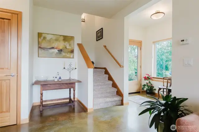 Front door entrance and stairs from living room