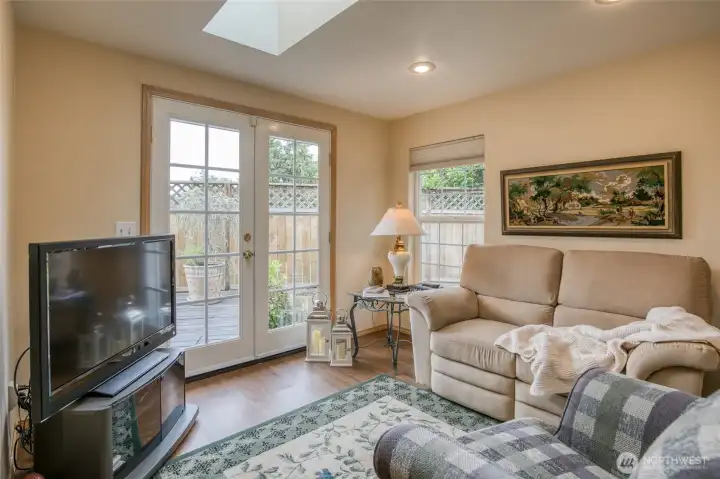 Entertainment room off the Kitchen with access to the large wooden deck.