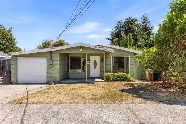 One story home on a large lot has over 1200sf, three bedrooms, one and a half baths, living and family rooms, and an attached garage plus ample additional parking