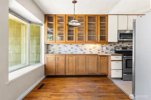 Built-in hutch area and large bay window with a box seat
