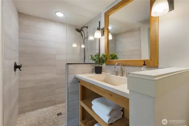 Bathroom on main floor and attached to the bonus room with Murphy bed and desk.