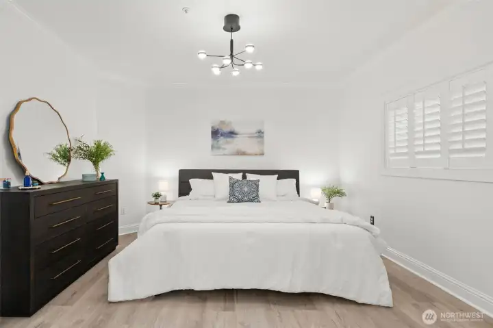 Primary Suite has new flooring, new light fixture, a walk-in closet, and it's own bathroom ensuite