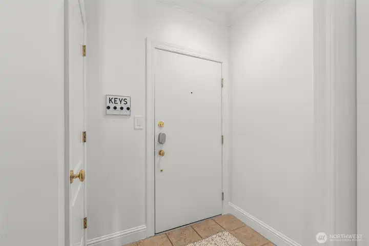 Entry hallway with coat closet on the left side of this photo