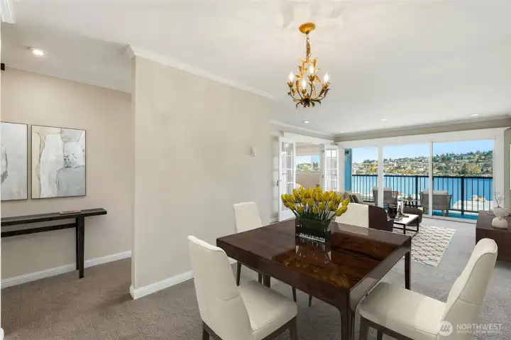 Open flow connects dining to living, letting the lakefront light spill in.