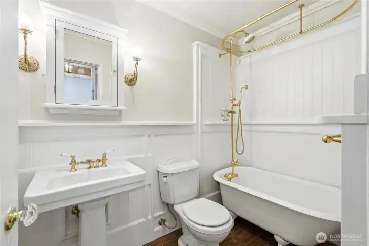 Classic clawfoot tub adds charm to this light-filled, vintage-inspired bath.