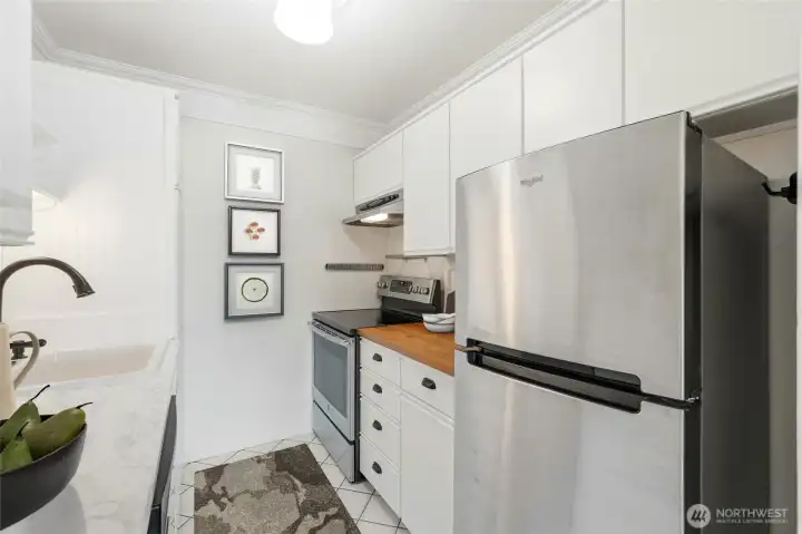 Sleek layout with ample storage and easy access to dining and living spaces.