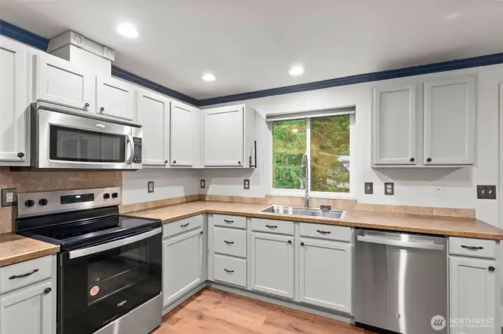 Brand new stainless steel appliances stay.