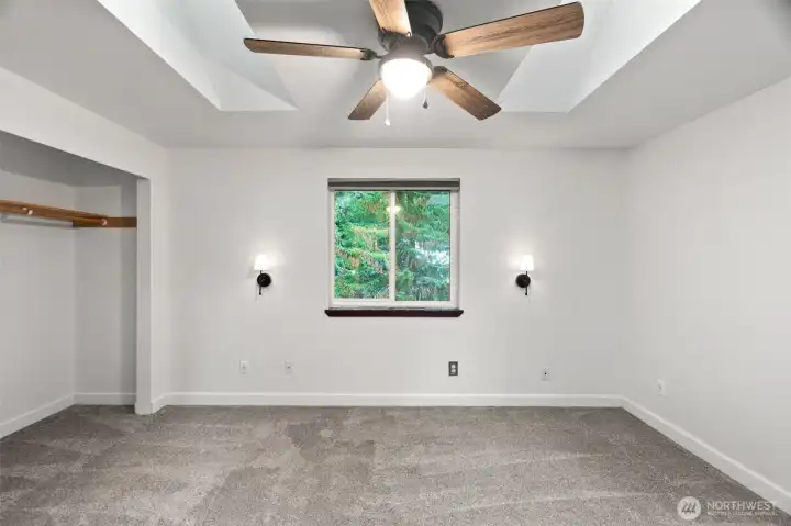 Primary bedroom with sky lights.