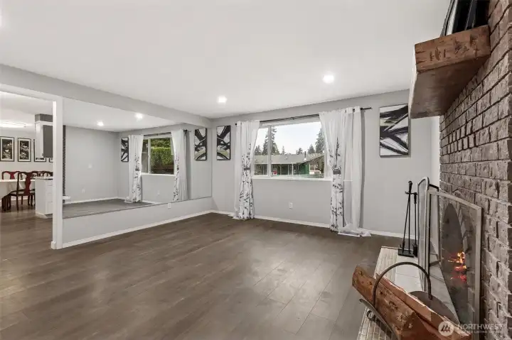 Another view of the living room w/the cozy fireplace.