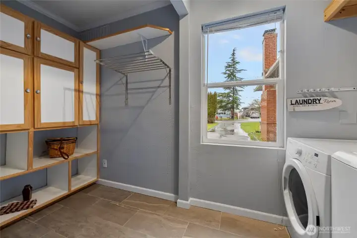 Laundry area with nice cabinets with brand new cloths washer