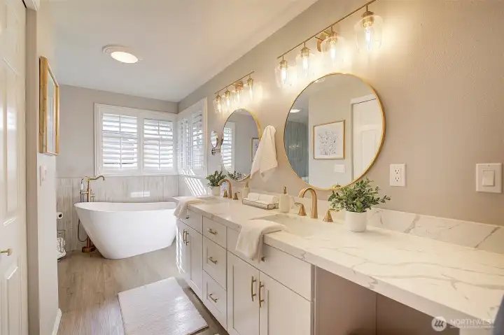 Thoughtfully designed, the cabinetry includes a cut-out for laundry baskets.