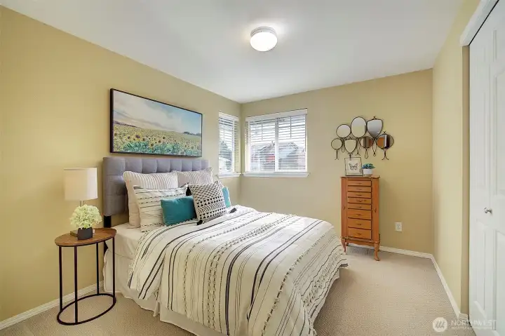 Bedroom 2 is shown here with a Queen size bed.  The closet includes a built-in organization system for clothes.