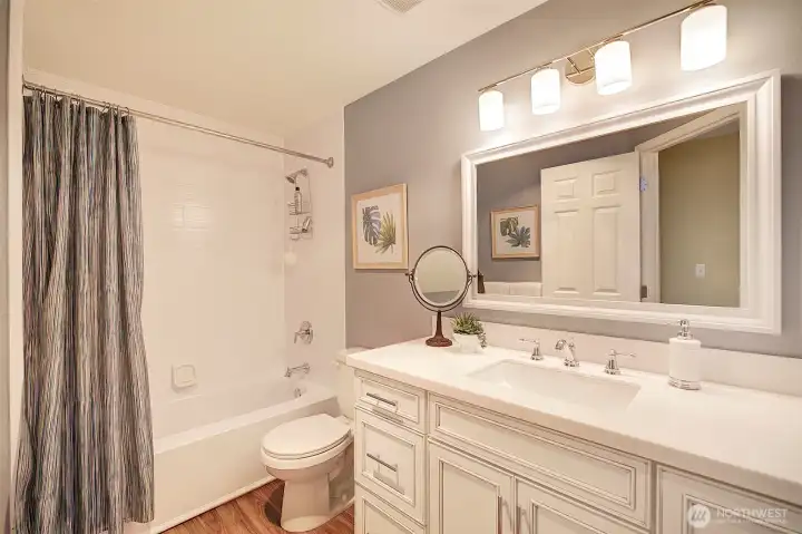 An additional full sized bath, also remodeled, is featured upstairs.