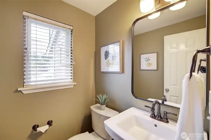 On the main floor another updated bath features a pedestal sink.