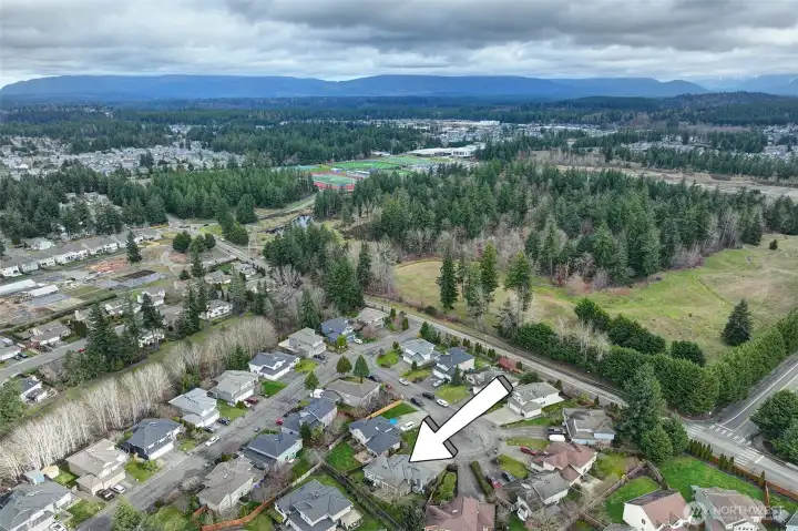 Just a short walk down the hill to the Tahoma High School campus and playfields.  You can see the the sports fields in the background.  An equal distance away is Glacier Park Elementary on the East side. Summit Park is a short distance away too.