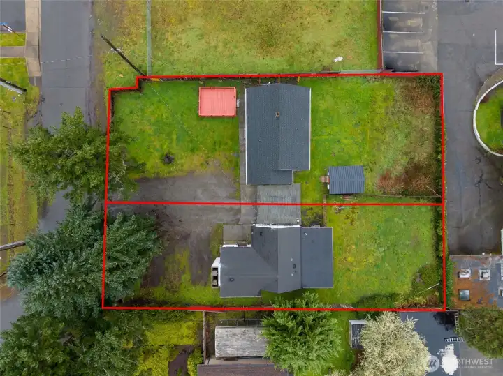 Aerial view showing both parcels- 6146 is the street facing lot with deck and shed; 6148 is the left/rear parcel.