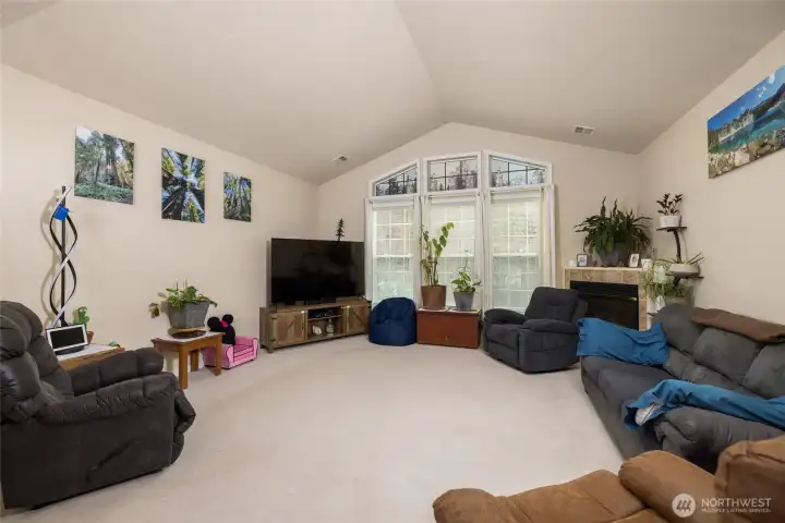 Large windows bring in the light, and vaulted ceilings open the space