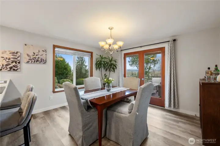 French doors leading out to the expansive deck from the dining room