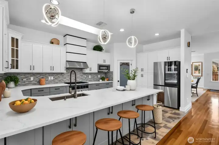 Spacious kitchen with peninsula seating - virtually staged