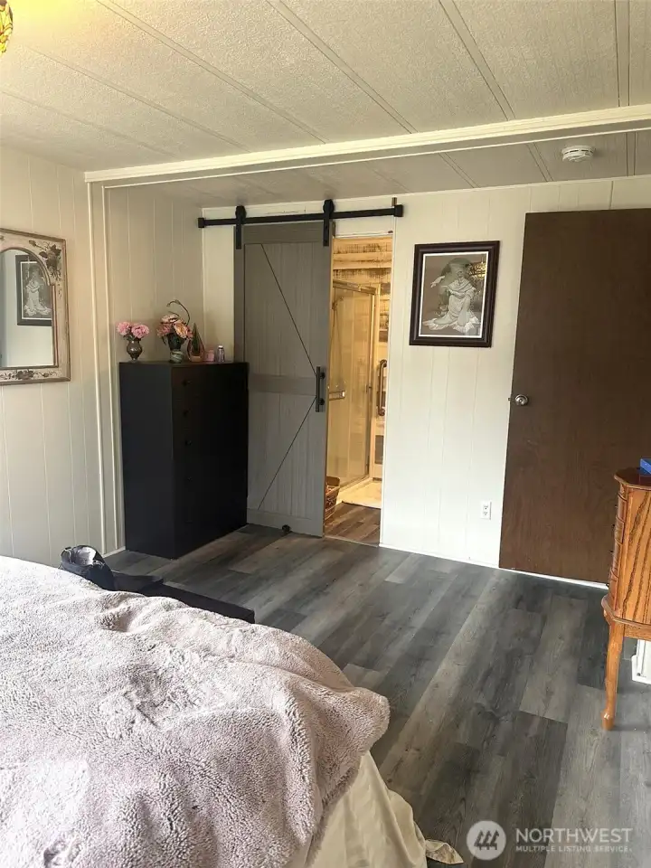 Notice the barn style door to the bathroom
