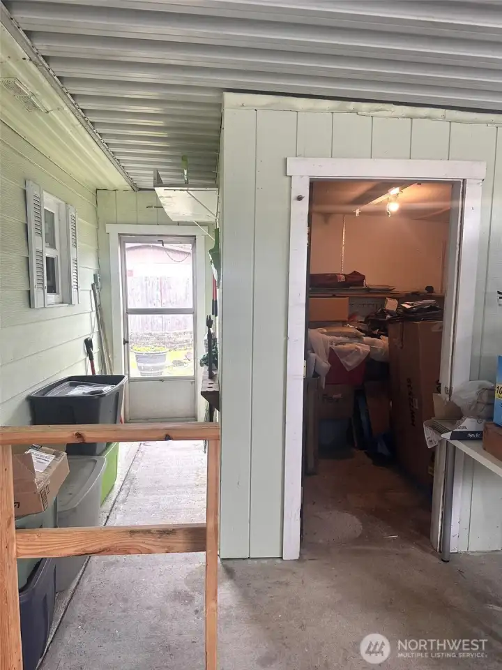 Shed in the carport to store all you outdoor tools.