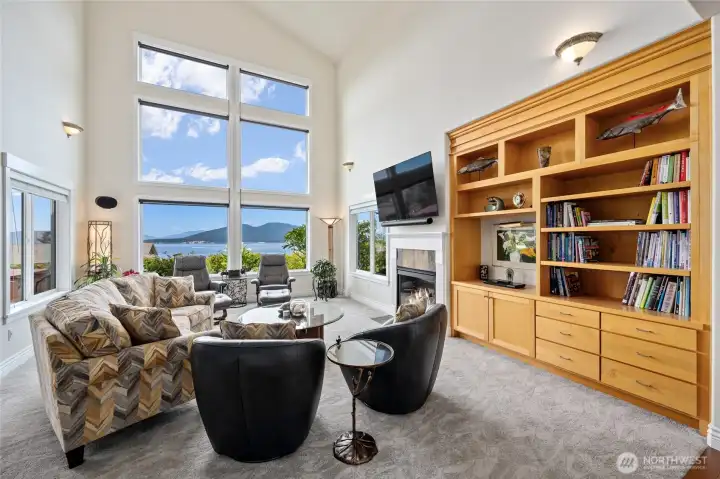 View living room features a gas fireplace & built-in cabinetry. View living room features a gas fireplace & built-in cabinetry.