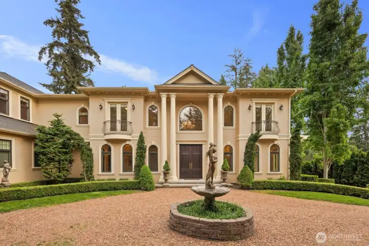 A one-of-a-kind Mediterranean-style villa that welcomes you into a plush, private retreat where timeless architecture meets refined comfort. From the moment you arrive, warm stucco tones, graceful rooflines, and artisan detailing set an elegant tone, while a grand entryway draws you into a world of understated luxury.    Inside, the home unfolds with rich textures, soaring spaces, and natural light that pours through expansive windows, creating a seamless connection between indoor elegance and the surrounding landscape. Thoughtfully curated finishes evoke a sense of old-world craftsmanship, balanced with modern livability designed for everyday ease.    Each space feels intentionally crafted for comfort and sophistication—from inviting gathering areas to tranquil private suites—offering a lifestyle that is both indulgent and relaxed. Outdoors, layered terraces and serene sitting areas extend the experience, inviting you to unwind, entertain, and savor the beauty of your surroundings.