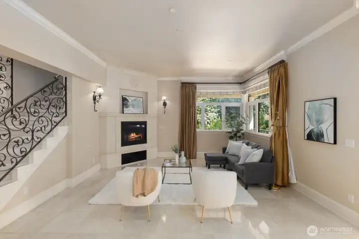 Even the back staircase is finished with ornate metalwork, reflecting the same attention to craftsmanship and detail found throughout the home. This architectural feature elevates a functional transition space into a design statement, reinforcing the property’s overall sense of luxury and cohesion.