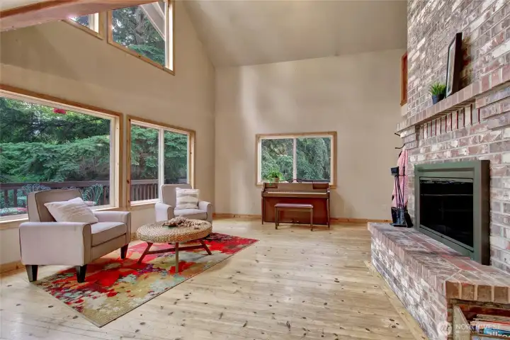 Family Room on the Main Floor with view of wood burning fireplace