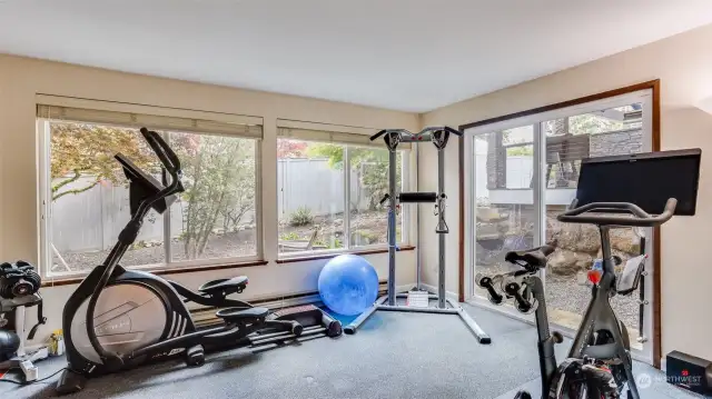 Stunning room of windows with slider leading to the back yard, it is truly a picture perfect place to get a good workout in or whatever you choose to make this space!