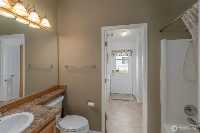 full updated hall bathroom- leads to utility room and door to side yard