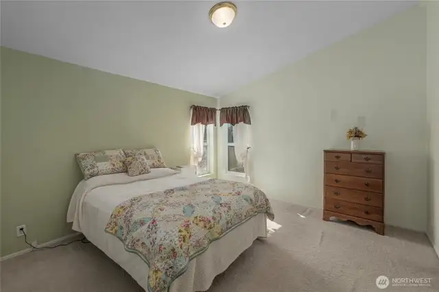 vaulted primary bedroom