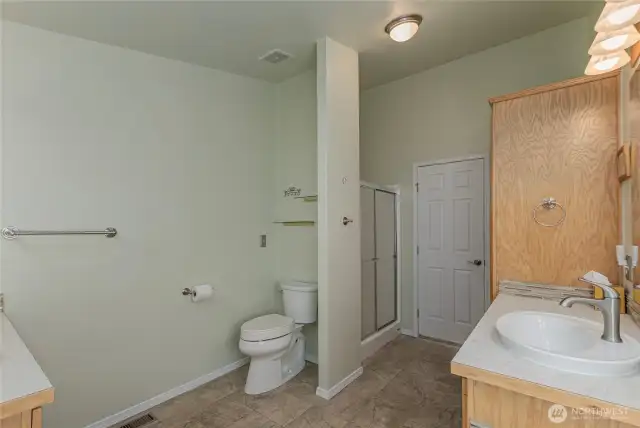 large primary bathroom, lots of storage, step in shower and soaking tub too!