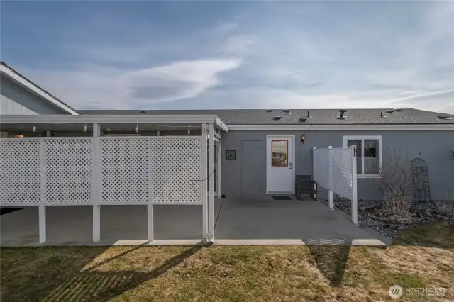 side covered patio, slider from dining, man door from utility room