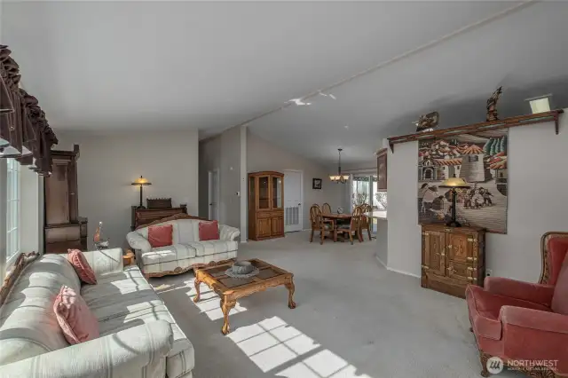 Spacious living area, vaulted ceilings, and natural light.