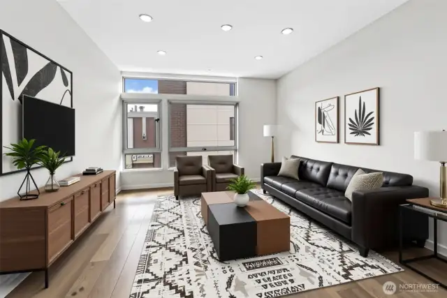 Note virtually staged living room. Boasts high ceilings and walls of windows.