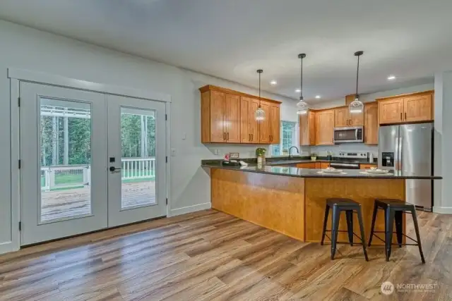 The French doors open to a massive covered deck