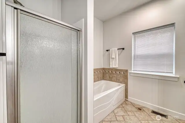 Tub and shower in the primary bath.