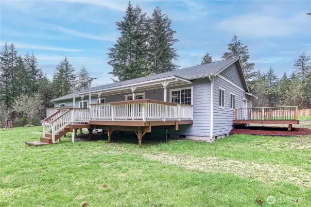The big deck off of the great room, and private deck to the right is off the primary suite.
