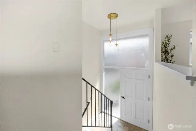 Main entry of the home with chandelier
