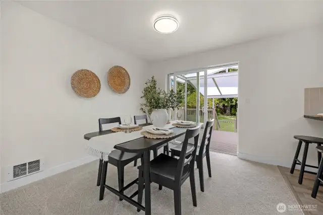 Dining room with slider out to covered deck