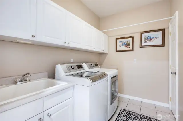 Utility Room with newer washer, dryer, and closet.