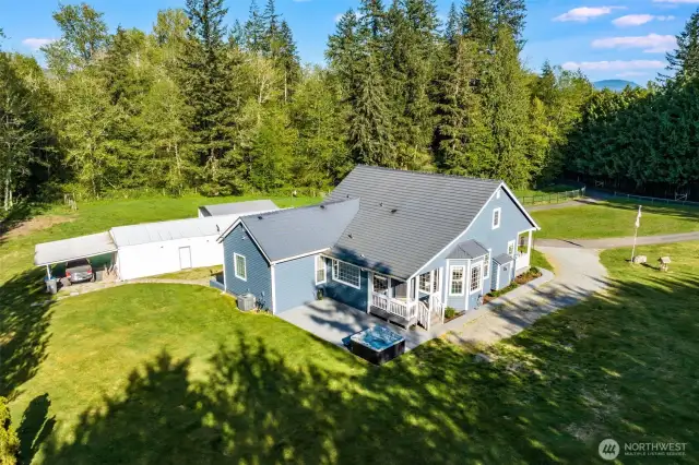 Great shot showing the back porch and the included hot tub.