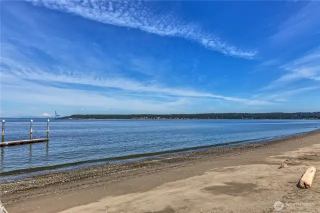 View of the private beach that the condo owner can enjoy, and dogs are allowed on leashes. Note Mt. Baker rising above all in the middle of the left-hand side of the photo, and Marrowstone Island is in the background.