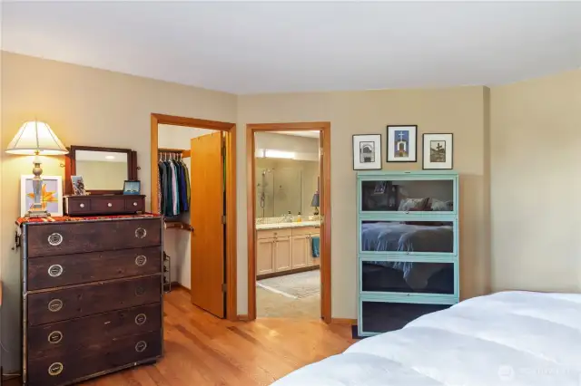 The primary ensuite has a spacious 5-piece full bathroom on the right, and a walk-in closet on the left.