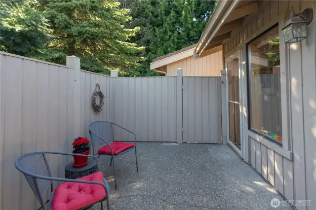 The private courtyard has access through the guest bedroom/den. The patio has a gate that leads to the front door walkway, note gate in the background.